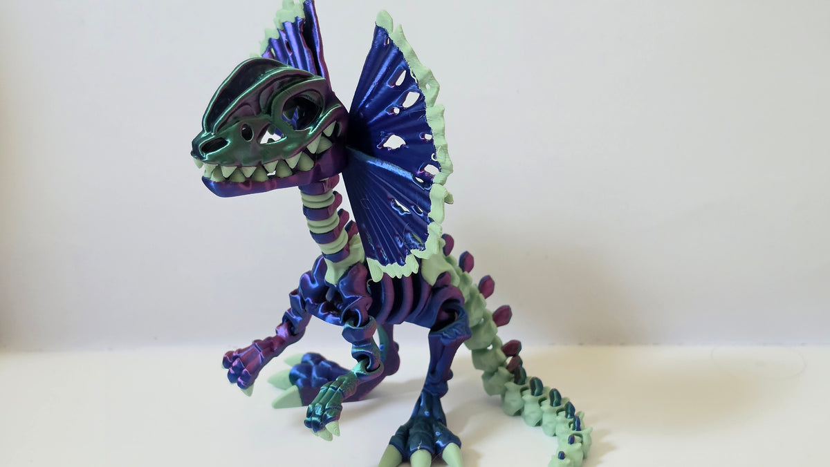 Purple green Dilophosaurus skelly