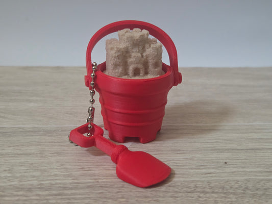 Red sand bucket clicker