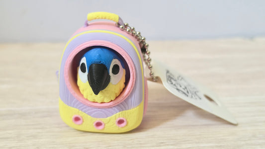 Pink parrot backpack clicker