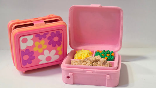 Mystery flower lunch box clicker