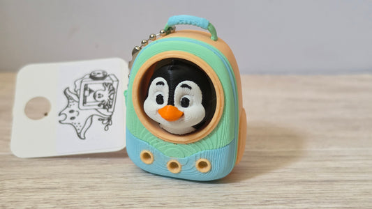 Blue penguin backpack clicker