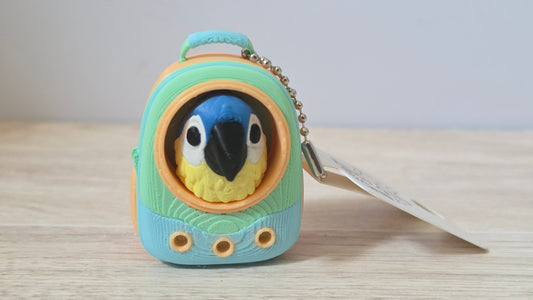 Blue parrot backpack clicker