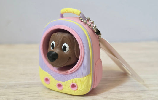 Pink dog backpack clicker