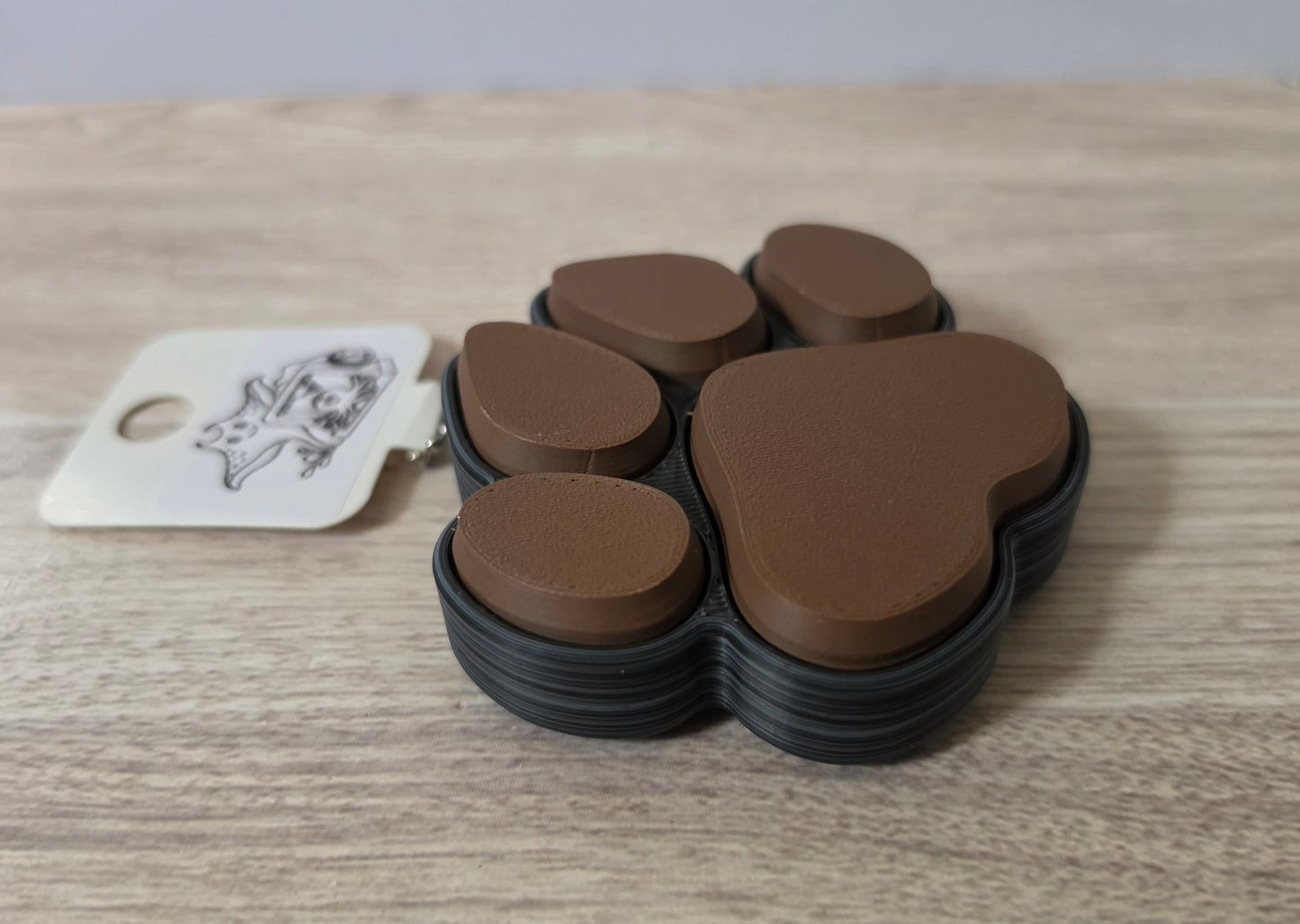 Black brown paw print clicker