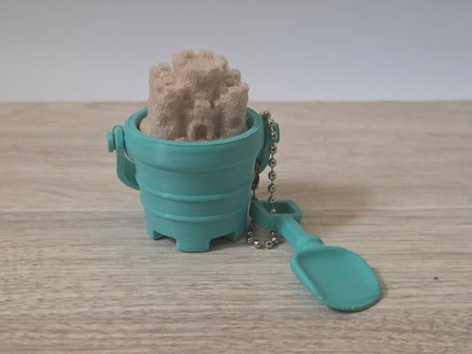 Teal sand bucket clicker