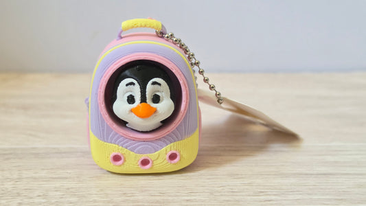 Pink penguin backpack clicker